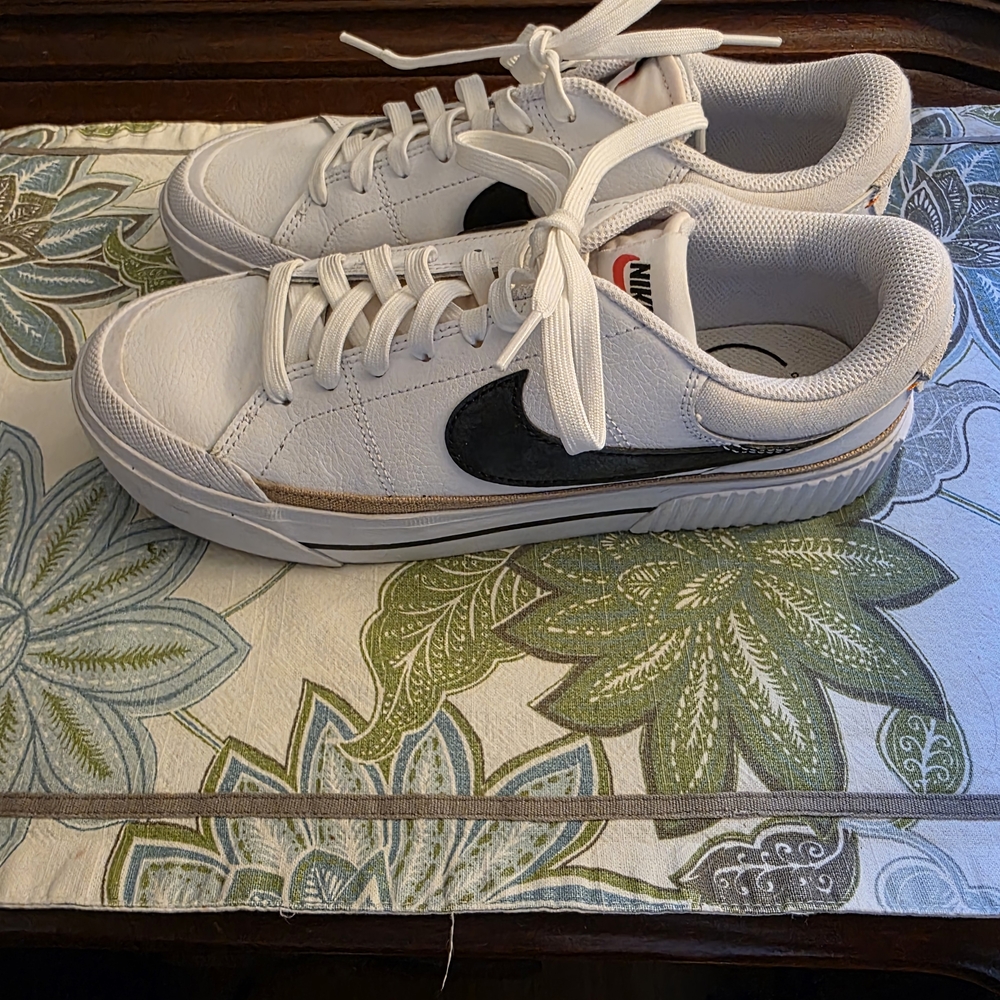 Nike White Sneakers with Black Swoosh